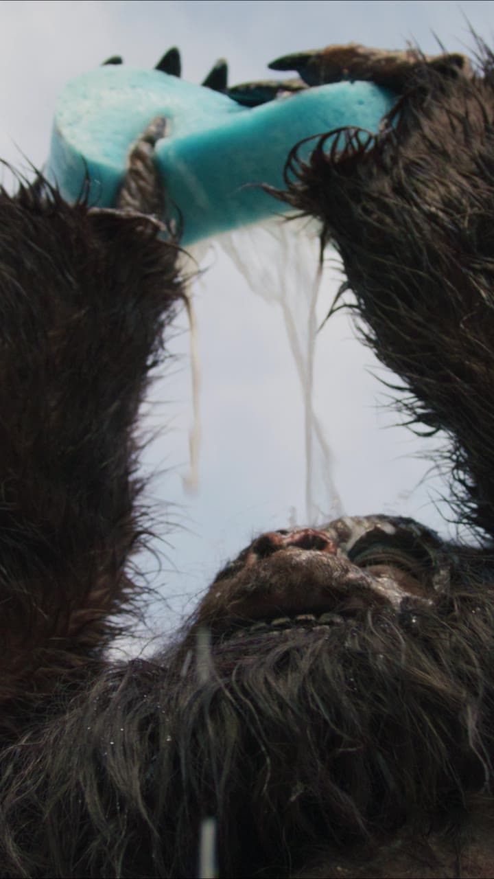 Bigfoot squeezing a sponge over his head